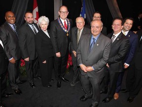 Windsor City Council pose for a group photo on stage following Inaugural Meeting of City Council event held at St. Clair College Centre for the Arts' Chrysler Theatre Monday December 01, 2014. Chris Holt, left, John Elliott, Rino Bortolin, Jo-Anne Gignac, Mayor Drew Dilkens, Hilary Payne, Ed Sleiman, Erik Kusmierczyk, Paul Borrelli, Fred Francis and Bill Marra, right. (NICK BRANCACCIO/The Windsor Star)