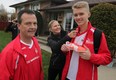 - Local socceer player Phillip Jurkowski, right, says his goodbyes to parents Marta, shown and Jacek Jurkowski, behind, as Phillip and Coach Paul Scott, left, head to the International Children's Games in Lake MacQuarie, Austrailia Tuesday December 2, 2014. (NICK BRANCACCIO/The Windsor Star)