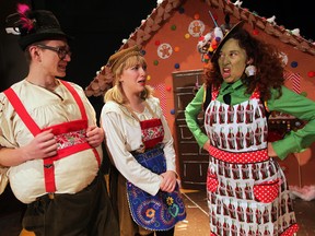 WINDSOR, ONT. December 08, 2014 --  Witch played by Tracey Atin, right, invites Hansel, Frank Varga and Gretel, Talia Ryckman-Klein into her gingerbread home in Korda Artistic Productions performance of Hansel and Gretel. Behind the Gingerbread, December 8, 2014.  (NICK BRANCACCIO/The Windsor Star)
