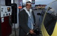 Mohammed Aman is all smiles while filling up at Windsor Variety and Gas on University Avenue West December 8, 2014.  (NICK BRANCACCIO/The Windsor Star)