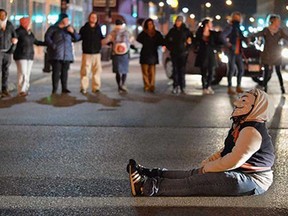 Demonstrators march in protest on the streets of St. Louis, Missouri on December 3, 2014. Nationwide outrage and protests have erupted since a New York City grand jury also decided not to indict a white police officer in the death of Eric Garner in Staten Island, New York on July 17, 2014.