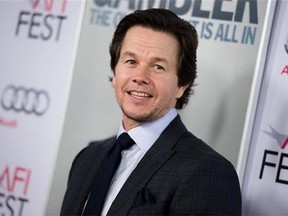 FILE - In this Nov. 10, 2014 file photo, Mark Wahlberg arrives at the 2014 AFI Fest - "The Gambler," in Los Angeles. Wahlberg is asking Massachusetts for a pardon for an assault he committed in 1988 when he was a troubled teenager in Boston. Wahlberg’s application with the Massachusetts Parole Board says he isn’t the same person he was 26 years ago and his past convictions are still affecting his life. (Richard Shotwell/Invision/AP, File)