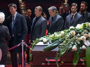 Members of the Vancouver Canucks line up to pay their respects to Elise Beliveau, widow of Jean Beliveau, during the visitation at the Bell Centre Monday, December 8, 2014 in Montreal. The Montreal Canadiens hockey legend passed away Tuesday, Dec. 2, 2014 at the age of 83.