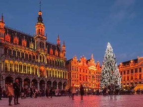A giant Christmas tree and a light show decorate the Grand Place in Brussels, Wednesday, Dec. 12, 2014. The Christmas tree is a gift of Riga, capital city of Latvia and European cultural capital 2014. This exceptional Christmas tree measures 22 meters (72 feet), one of the highest to have adorned the Grand Place, and is one of the many attractions the Brussels' Christmas market has to offer.