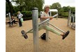 Tessa Morrison (R) is watched by Katherine Thompson (L) and Jill Jones (Second Left) as she exercises in London's first purpose built 'Senior Playground' in Hyde Park on May 19, 2010 in London, England. The playground, which cost 50,000 GBP, features six machines: a cross-trainer, sit-up bench, body-flexer, free runner, flex wheel and an exercise bike.(Oli Scarff/Postmedia News)