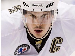 Pittsburgh Penguins' Sidney Crosby lines up for a face off during NHL hockey action against the Toronto Maple Leafs in Toronto on November 14, 2014. Crosby has the mumps.The Penguins confirmed the news Sunday morning after the captain sat out two games for precautionary reasons.
(Darren Calabrese/Postmedia News)