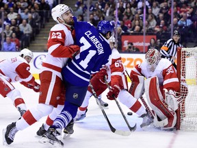 Detroit's Brian Lashoff. left, checks Toronto's David Clarkson at the Air Canada Centre. (THE CANADIAN PRESS/Frank Gunn)