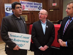 Mehdi Kouhestaninejad, left, and Mike Luff, both of Canadian Labour Congress speak with speaker Dr. Chris Simpson, right of Canadian Medical Association during a public meeting on improvements to retirement security for all, Thursday December 11, 2014. (NICK BRANCACCIO/The Windsor Star)