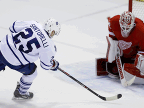 Toronto's Mike Santorelli, left, scores the winning goal on goalie Jimmy Howard during the shootout  Wednesday at Joe Louis Arena. (AP Photo/Carlos Osorio)