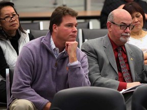Coun. Mike Rohrer, left, and Mayor Gary McNamara, both of Tecumseh, listen to discussions involving St. Gregory School during Windsor-Essex Catholic District School Board meeting at Windsor Essex Catholic Education Centre on California Avenue Tuesday December 16, 2014.  (NICK BRANCACCIO/The Windsor Star)