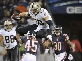 New Orleans' Jimmy Graham, top, jumps over Chicago's Kyle Fuller, left, and Brock Vereen during the fourth quarter at Soldier Field in Chicago. (Photo by David Banks/Getty Images)