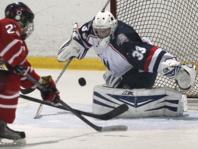 Brennan's Jared Brothers, left, is stopped by Holy Names goalie Dan Miceli at the Southern Ontario High School Hockey Classic tournamet at the WFCU Centre Tuesday. (DAN JANISSE/The Windsor Star)