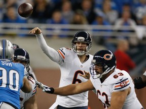 Chicago quarterback Jay Cutler, centre, throws a pass against the Detroit Lions at Ford Field. (Photo by Gregory Shamus/Getty Images)