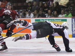 Windsor's Daniil Vertiy, right, collides with Guelph's Chadd Bauman at the WFCU Centre. (DAX MELMER/The Windsor Star)