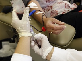 (File photo) Donating blood at Canadian Blood Services in Windsor, Ont.,  (JASON KRYK/ THE WINDSOR STAR)