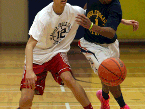 Kennedy's Isiah Osborne, left, and Alston Gayle chase a loose ball during the high school all star game at Kennedy in March. (TYLER BROWNBRIDGE/The Windsor Star)