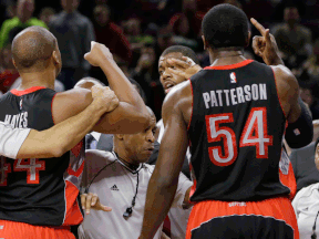 The referees separate Toronto's Chuck Hayes, left, and Patrick Patterson, right, from Detroit's Greg Monroe, who was shielding Andre Drummond during the second half at the Palace in Auburn Hills Friday. Drummond smashed into James Johnson with a forearm and hip smash and set off a melee that saw Drummond get a flagrant foul and four technicals called. The Raptors won 110-100. (AP Photo/Carlos Osorio)