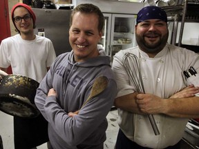 Scott Stevens, centre, owner of Chanosos, is ready, willing and able with Chef Perry Deconinck and cook Marc Tessier, left, for their annual Christmas dinner for the underprivileged.  (NICK BRANCACCIO/The Windsor Star)