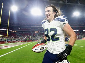 LaSalle's Luke Willson of the Seattle Seahawks runs off the field with the Sunday night football player of the game ball after defeating the Arizona Cardinals 35-6 in Glendale. (Photo by Christian Petersen/Getty Images)