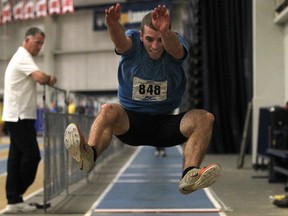 Destin Gardner competes in the long jump at the University of Windsor Blue and Gold Inter-Squad meet at the St. Denis Centre Monday. (DAX MELMER/The Windsor Star)