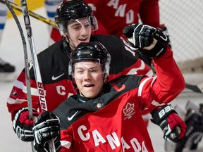 Team Canada's Curtis Lazar celebrates his goal past Team Finland goaltender Juuse Saros during third period preliminary round hockey action at the IIHF World Junior Championship Monday in Montreal. (THE CANADIAN PRESS/Paul Chiasson)