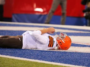 Johnny Manziel #2 of the Cleveland Browns lies on his back after being knocked down against the Buffalo Bills during the second half at Ralph Wilson Stadium on November 30, 2014 in Orchard Park, New York.  (Photo by Brett Carlsen/Getty Images)