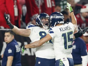 LaSalle native Luke Willson, left, Seattle Seahawks celebrates with wide receiver Jermaine Kearse #15 after catching an 80-yard touchdown reception in the second quarter against the Arizona Cardinals at the University of Phoenix Stadium on December 21, 2014 in Glendale, Arizona.  (Photo by Christian Petersen/Getty Images)