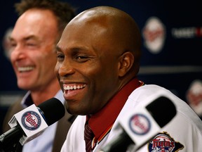 Minnesota Twins manager Paul Molitor, left, and Torii Hunter hold a press conference at Target Field Wednesday. (AP Photo/The Star Tribune, Carlos Gonzalez)