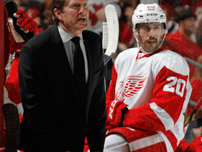 Wings head coach Mike Babcock, left, argues a call while Drew Miller watches in a game against the New Jersey Devils at the Prudential Center last month. (Photo by Bruce Bennett/Getty Images)