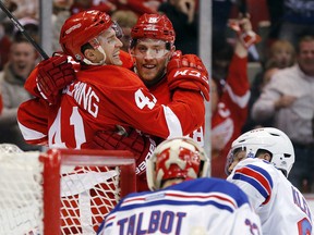 Detroit's Luke Glendening, left, celebrates with Joakim Andersson after scoring against Rangers goalie Cam Talbot in the second period Saturday at Joe Louis Arena. (AP Photo/Paul Sancya)
