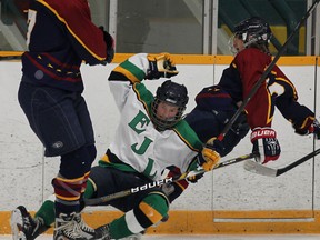 Lajeunesse's Cole Seguin, centre, collides with Leamington's Alex Kaspardlov, left, and Jack Towle in high school boys hockey Monday. (DAN JANISSE/The Windsor Star)