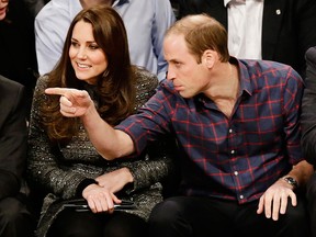 Britain's Prince William, right, and Kate, Duchess of Cambridge, watch the second half of an NBA basketball game between the Brooklyn Nets and the Cleveland Cavaliers, Monday, Dec. 8, 2014, in New York. (AP Photo/Frank Franklin II)
