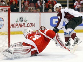 Avalanche center Matt Duchene (9) scores on Red Wings goalie Petr Mrazek (34) in a shootout in Detroit Sunday, Dec. 21, 2014. Colorado won 2-1. (AP Photo/Paul Sancya)