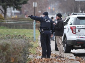 Windsor police officers investigate after a man allegedly threatened a woman with a shovel in the 900 block of Erie Street on Saturday, Dec. 27, 2014. (DAX MELMER/The Windsor Star)