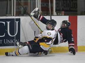 LaSalle Sabres Hunter Dent collides with Slovakia's Alexander Korienek during the first period of the Bantam Hockey game at the WFCU Centre in Windsor, Ontario on December 30, 2014. (JASON KRYK/The Windsor Star)