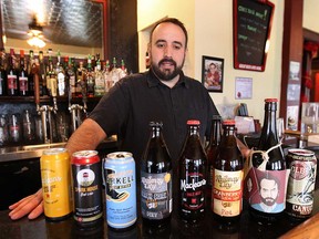 Rino Bortolin of Rino's Kitchen in Windsor, ON. is shown at the restaurant with a sample of the mircobrewed beers he carries. He does not purchase any beer from The Beer Store. (DAN JANISSE/The Windsor Star)