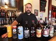 Rino Bortolin of Rino's Kitchen in Windsor, ON. is shown at the restaurant with a sample of the mircobrewed beers he carries. He does not purchase any beer from The Beer Store. (DAN JANISSE/The Windsor Star)