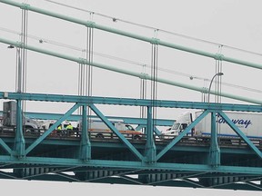 Fire and ambulance personnel from Windsor and Detroit deal with a collision on the Ambassador Bridge on Tuesday, Dec. 16, 2014.   (DAN JANISSE/The Windsor Star)