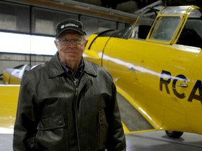 Chief pilot for the Canadian Historical Aircraft Association Ron Holden is pictured before a Harvard Mk IV in CH2A's hangar at Windsor International Airport, Wednesday, Nov. 26, 2014. The Harvard is the first acquisition for CH2A in 12 years. (RICK DAWES/The Windsor Star)