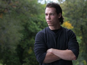 Sandor Mozes looks out from his balcony, Friday, Oct. 17, 2014.  (DAX MELMER/The Windsor Star)