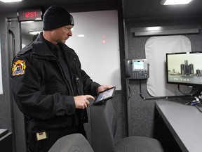 Windsor police and fire departments displayed their new shared mobile command unit on Monday, Dec. 1, 2014, in Windsor, ON. Firefighter Mike Menard displays a 360 degree high powered on board camera that is controlled by a computer tablet. (DAN JANISSE/The Windsor Star)