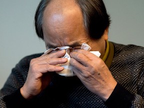 Diran Lin wipes away tears as he speaks to the media at a news conference Monday, Dec. 29, 2014 in Montreal. Lin is the father of Jun Lin, who was murdered and dismembered by Luka Rocco Magnotta in a case that made international headlines. Magnotta was found guilty of first degree murder and sentenced to life in prison. THE CANADIAN PRESS/Ryan Remiorz