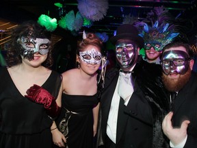 Masked revellers Lauren Oliver (left), Brittany Hayward, Andrew Brien, Paul Brouwer (back) and Rielly McLaren at The Windsor Star News Cafe on Dec. 31, 2014. (Nick Brancaccio / The Windsor Star)