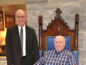 LaSalle Mayor Ken Antaya, from left, and LaSalle resident Bob Clark spoke Tuesday, Dec. 16, 2014 about the speaker's chair his grandfather Major Clark used at Queen's Park and that he donated to the town. The chair has a place of honour in the new  Council Chambers. (JULIE KOTSIS/The Windsor Star)