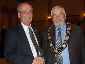 Newly elected Essex County Deputy Warden Ken Antaya, left and Warden Tom Bain are all smiles during the inaugural meeting of Essex County Council Wednesday, Dec. 10, 2014, at the Ciociaro Club. (JULIE KOTSIS/The Windsor Star)