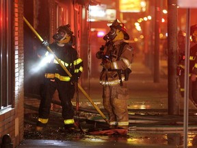 Fire crews work to extinguish a fire at a commercial property at 1122 Wyandotte St. E., Tuesday, Dec. 16, 2014.  (DAX MELMER/The Windsor Star)