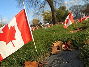 Canadian flags mark the graves of veterans at Heavenly Rest Cemetery in this 2011 file photo. (Tyler Brownbridge / The Windsor Star)