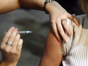 A vaccine is administered in this file photo. THE CANADIAN PRESS/Jeff McIntosh