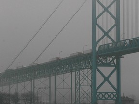 Fog drapes the Ambassador Bridge on Dec. 20, 2013. (Dax Melmer / The Windsor Star)