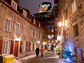 People take in the sights as Christmas lights line walks ways in Old Quebec City Sunday, December 21, 2014 .THE CANADIAN PRESS/Jacques Boissinot